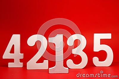 Counting numbers 1 2 3 4 5 white number wooden on Red Background with Copy Space - One Two Three Four Five Stock Photo