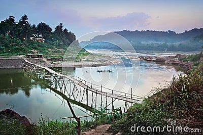 Country bridge across Mekong river, Luang Prabang, Laos. Stock Photo