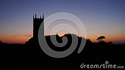 This serene scene of a country church in Cornwall England photographed at Sunset Stock Photo