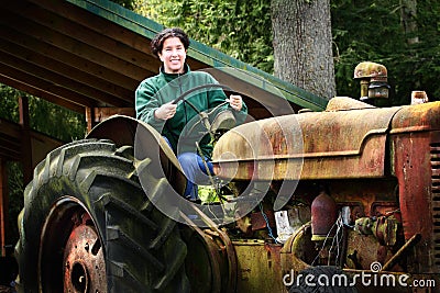 A Country Lady Driving Old Tractor Stock Photo