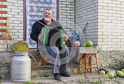 Country-man playing button accordion Stock Photo