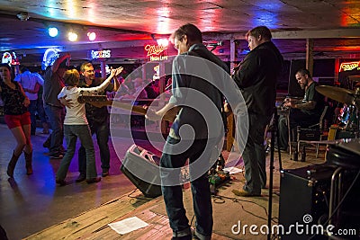 Country music band playing and people dancing in the Broken Spoke dance hall in Austin, Texas Editorial Stock Photo