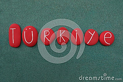 TÃ¼rkiye, souvenir with red colored stones over green sand Stock Photo