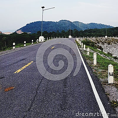 Country road against mountain Stock Photo