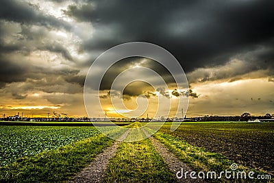 Country road dramatic sky sunset Stock Photo