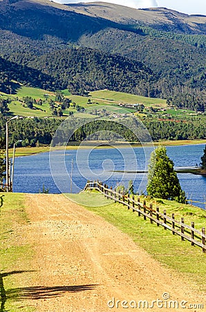 Country Road and Lake Stock Photo