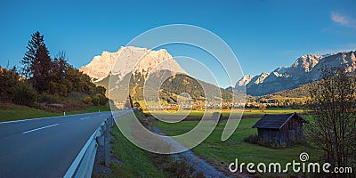 Country road from Lermoos to Ehrwald, view to Zugspitze mountain in the evening Stock Photo