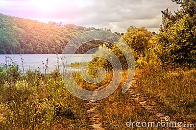 Country road in the meadow. over the river. nature background. Stock Photo