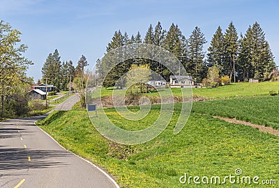 Country road and residences rural Oregon Stock Photo