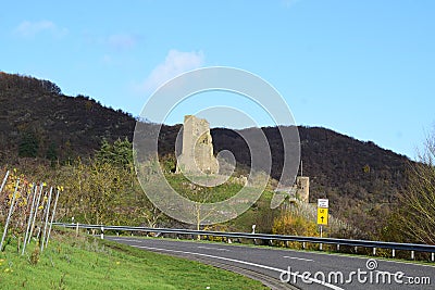 country road view ruin of Burg Coraidelstein and a traffic sign for the blocked main road Stock Photo