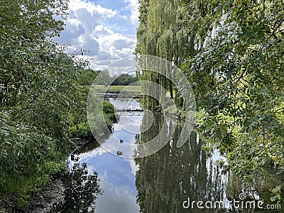 a country view over a still river Stock Photo