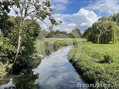 a country view over a still river Editorial Stock Photo