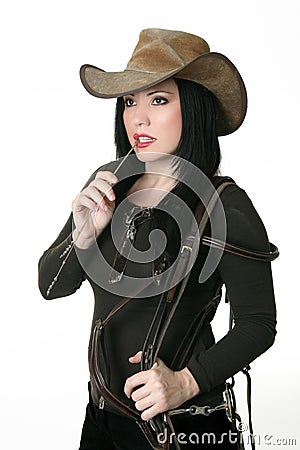 Country woman carrying a bridle Stock Photo