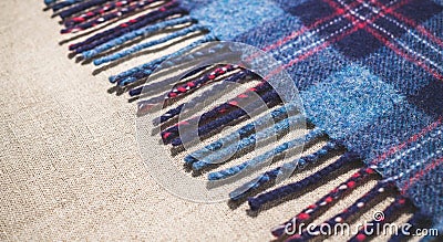Country woolen fabric. Fringe of an old Scottish warm blanket Stock Photo