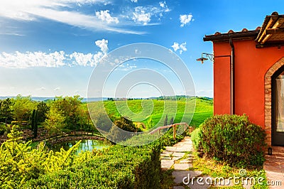 Countryhouse with a view of the green hills in Tuscany, Italy Stock Photo