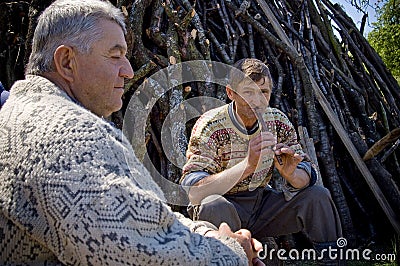 Countryman Playing the Pipe Editorial Stock Photo