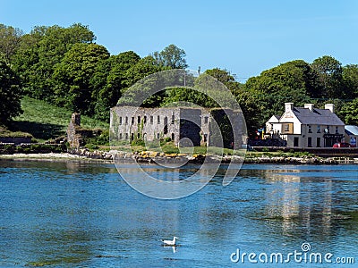The ruins of grain store on the shore of Clonakilty Bay on a sunny spring day. Irish landscape Editorial Stock Photo
