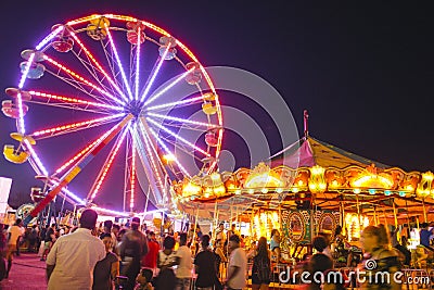 County Fair at night with ferris wheel Editorial Stock Photo