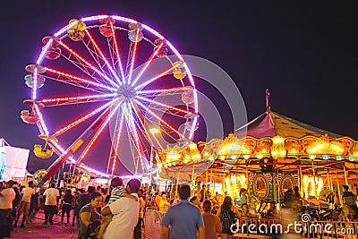 County Fair at night with ferris wheel Editorial Stock Photo