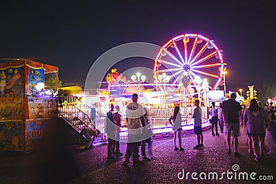 County Fair at night with ferris wheel Editorial Stock Photo