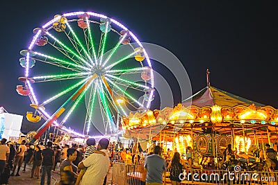 County Fair at night with ferris wheel Editorial Stock Photo