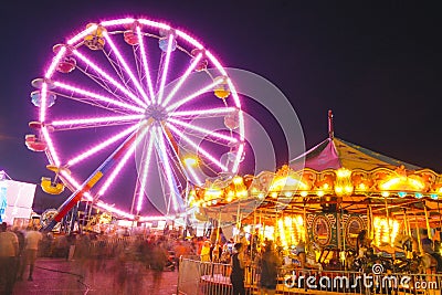 County Fair at night with ferris wheel Editorial Stock Photo