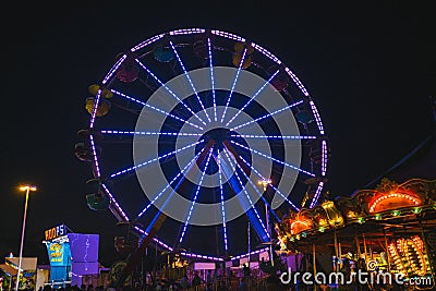 County Fair at night Ferris Wheel on the Midway Editorial Stock Photo