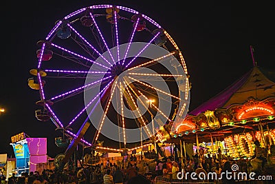 County Fair at night Ferris Wheel on the Midway Editorial Stock Photo