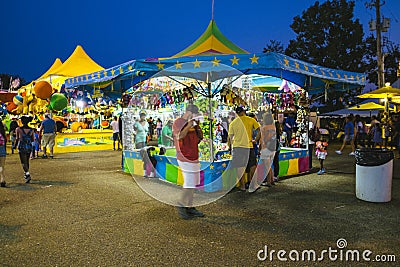 County Fair at night, Games on the midway Editorial Stock Photo