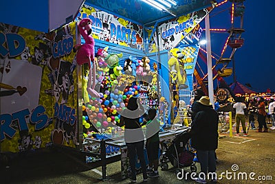 County Fair at night, Games on the midway Editorial Stock Photo