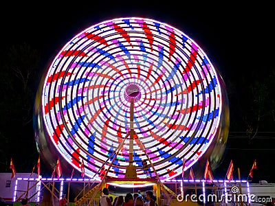 County Fair ride, at night, in motion. Gwinnett County, GA. Editorial Stock Photo