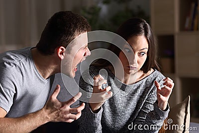 Couple arguing and shouting at home Stock Photo