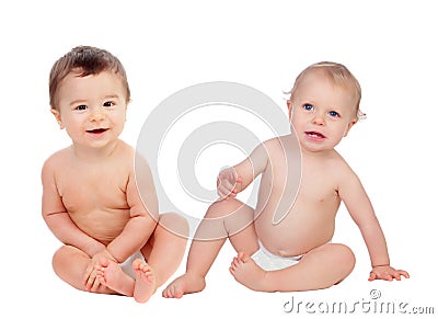 Couple of babies sitting on the floor Stock Photo