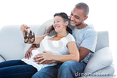 Couple with baby shoes Stock Photo