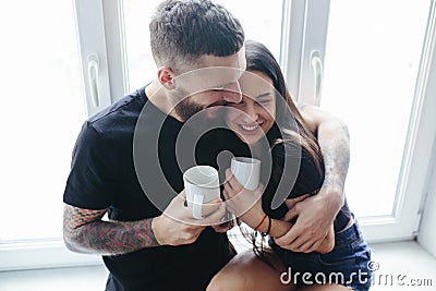 Couple on the background of a window Stock Photo