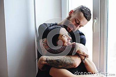 Couple on the background of a window Stock Photo