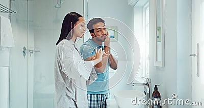 Couple, bathroom and cleaning face with cream, skincare and comic joke with laughing, serum or product. Man, woman and Stock Photo