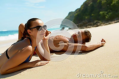 Couple On Beach In Summer. Romantic People On Sand At Resort Stock Photo