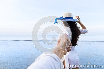 Couple On Beach Summer Vacation, Beautiful Young Girl Hold Male Hand People Looking Sea Stock Photo