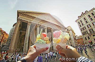Couple with beautiful bright sweet Italian ice-cream with different flavors in the hands Editorial Stock Photo
