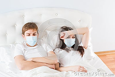 Couple in bed suffering common cold Stock Photo