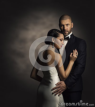 Couple in Black Suit and White Dress, Rich Man and Fashion Woman Stock Photo