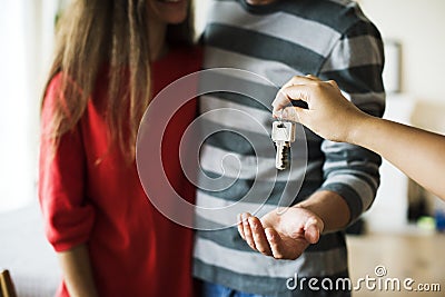 Couple bought new house keys being handed Stock Photo