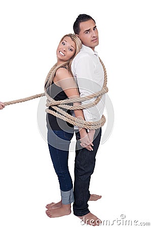 Couple bound together by a rope Stock Photo