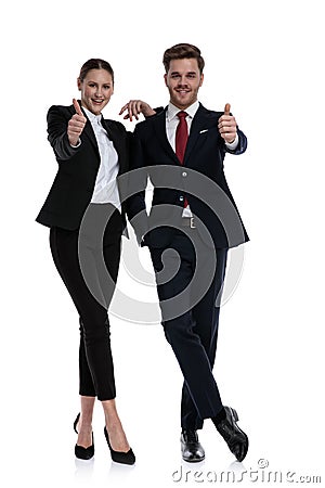 Couple in business suits liking with thumbs up Stock Photo