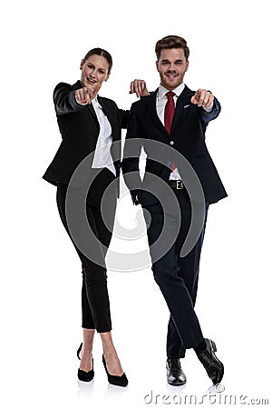 Couple in business suits pointing Stock Photo