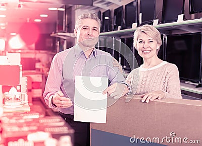 Couple are buying in store on credit Stock Photo