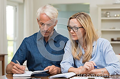 Couple calculating bills Stock Photo