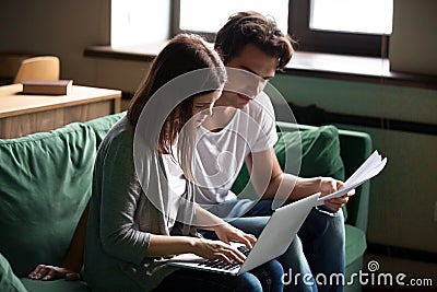 Couple calculating domestic bills, managing finances or taxes wi Stock Photo