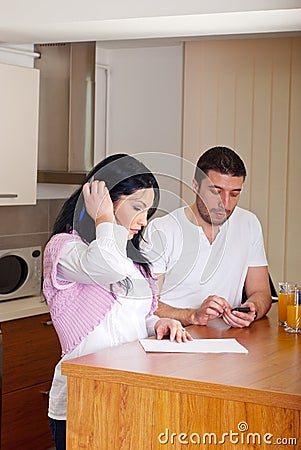 Couple calculating and writing Stock Photo